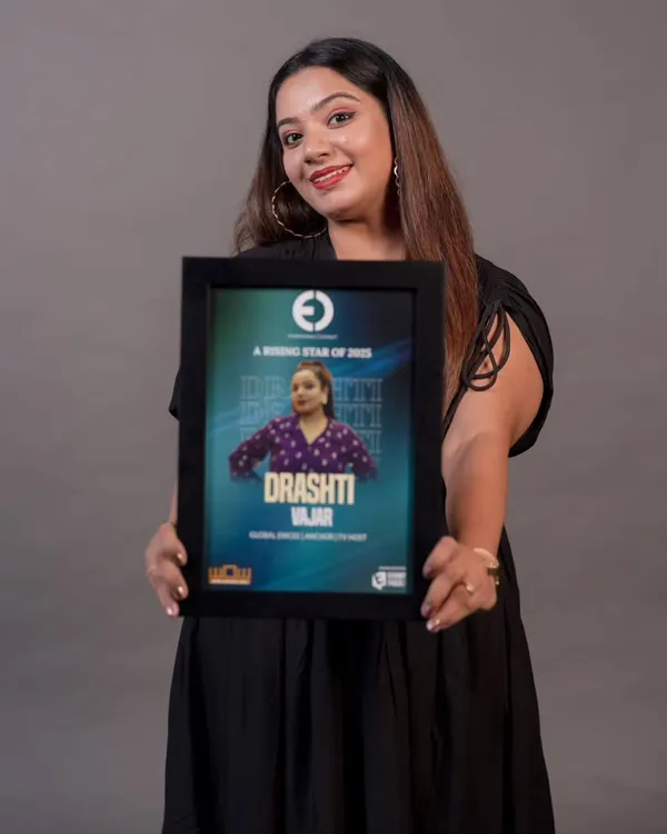 Holding my 'Rising Star of 2025' award from Entertainers Connect. This recognition is a proud milestone in my career as a global emcee and TV host.