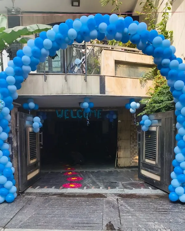 A grand balloon arch in shades of blue to welcome a baby boy home. I also added "It's a Boy" foil balloons to the entrance for a festive touch.