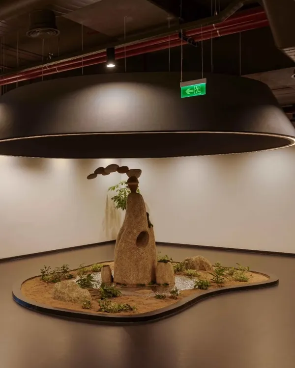 A wider view of the eco-friendly rock installation for My Home Group. The piece is designed to be a focal point in the corporate lobby, reflecting the brand's connection to nature and its solid, resilient foundation.