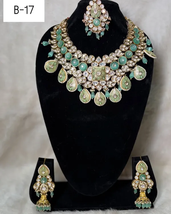 This is my mint green bilandi set, B-17. The soft pastel green enamel work combined with polki stones creates a fresh, modern, and elegant look.
