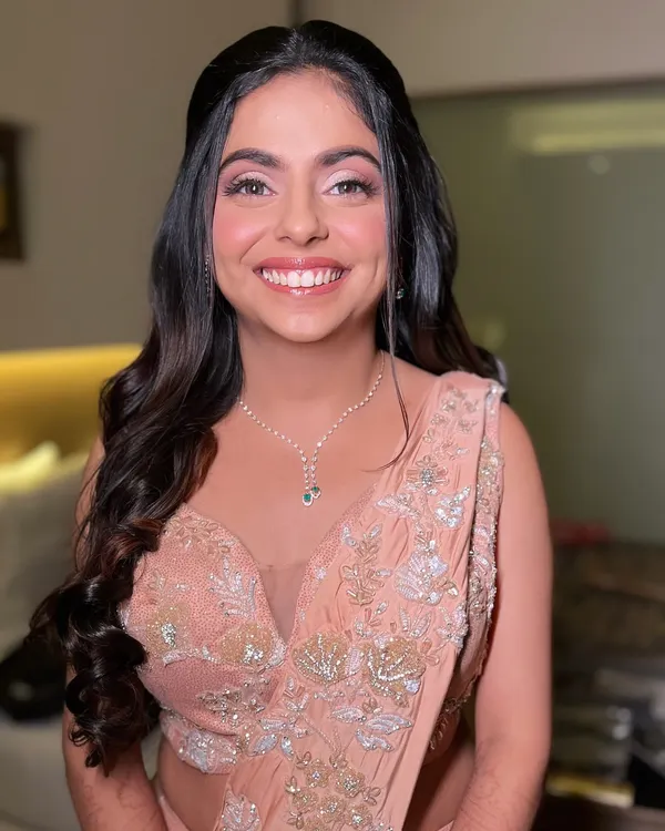 The perfect soft glam look for a reception or engagement party. I gave this beautiful bride a radiant smile with glowing skin, soft pink eyeshadow, and elegant waves in her hair.