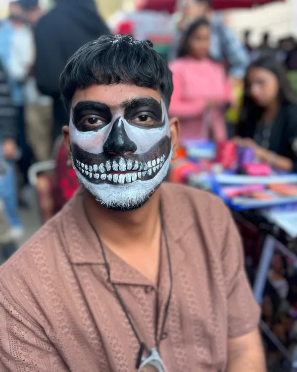 When someone says face painting is only for girls, I show them this. A classic black and white skull design is one of the most requested looks for men at music festivals and Halloween parties.