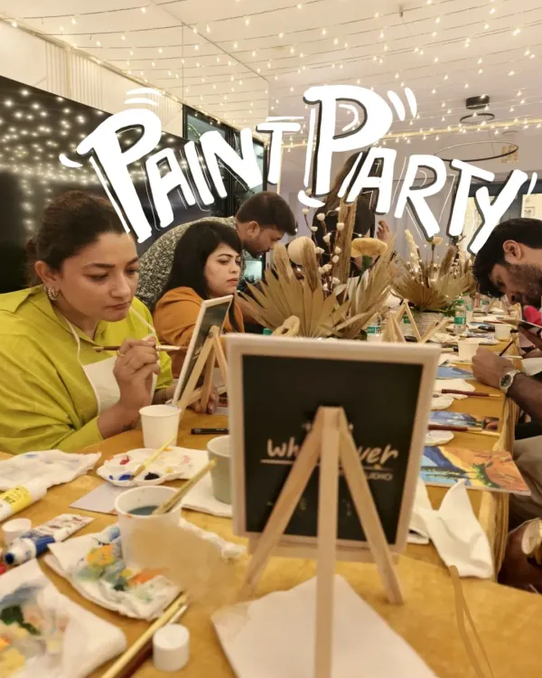 This is the vibrant, focused energy of our paint parties. We set up a long table where guests can sit together, paint, and socialize. It's a wonderful icebreaker and a relaxing way to connect at any event.