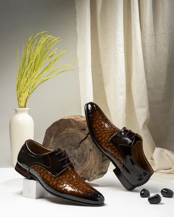 This shot of two-tone formal shoes was styled to convey classic elegance. I used a clean background with natural elements like wood and dried grass to create a sophisticated look perfect for a men's luxury footwear brand.
