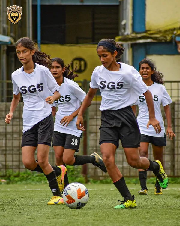 Our Lionesses showing skill and determination on the ball during a competitive match. We focus on developing strong, confident female players.
