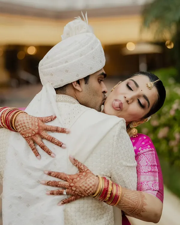 A playful and candid moment between the bride and groom. This is the kind of unscripted joy I love to capture, showing the fun and comfortable love they share.
