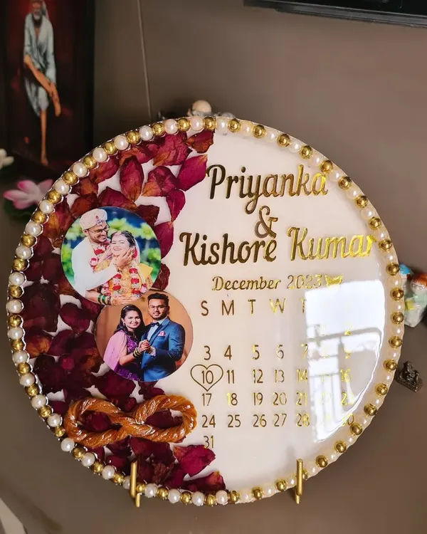 A special keepsake for a client, preserving their thali thread and varmala flowers in a circular resin frame. I also included their names and a calendar marking their special date, making it a truly personalized piece of wedding memorabilia.
