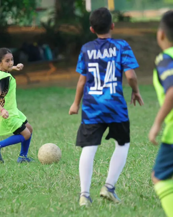 A young lioness focused on the ball during a practice match. We are proud to have girls training and competing alongside the boys.