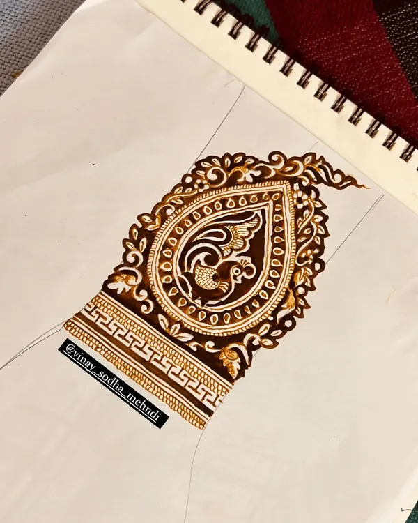 A sketch of a paisley motif with a peacock inside. This is the first step in creating a custom design element for a client.