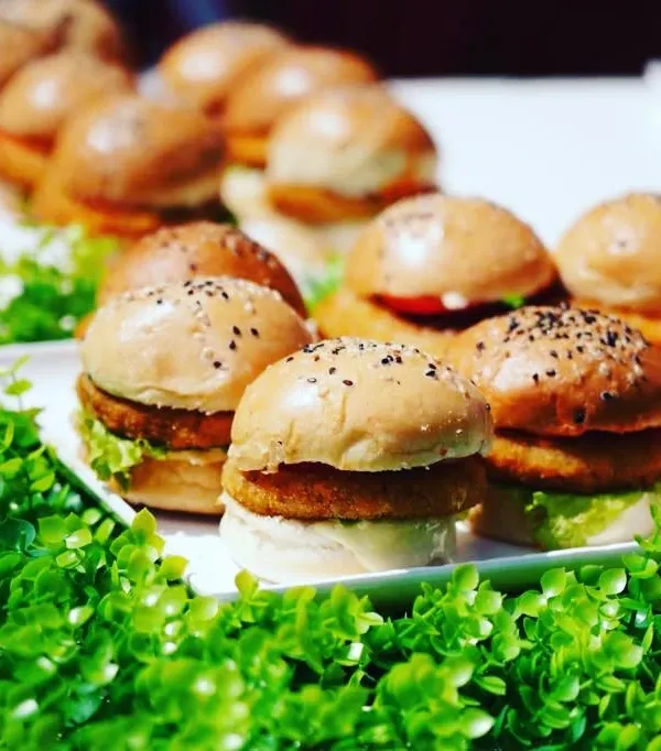My mini veg sliders are a party in every bite. Served on a bed of fresh greens, these burgers are a healthy and delightful option for guests of all ages.