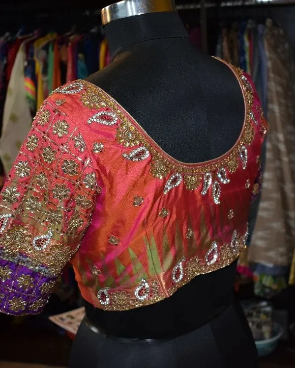 The back view of the custom silk blouse, showcasing the continuity of the detailed Kundan and zardozi work. Every angle is designed to look flawless.