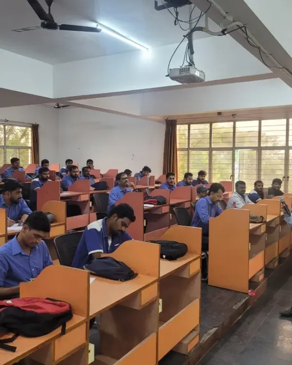 A trainer engages with employees during an English language session at Toyota Kirloskar. Our focus is on interactive learning, ensuring every participant gets an opportunity to speak and practice.