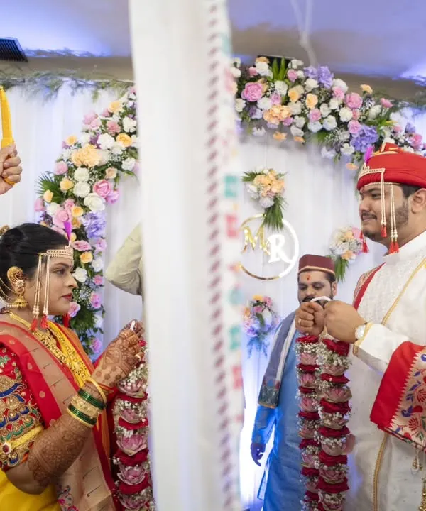 The 'Antarpat' moment, filled with anticipation and emotion, just before the couple sees each other for the first time at the mandap.