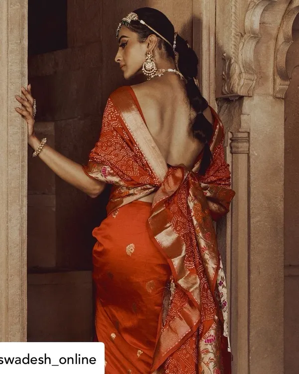For this high-fashion lookbook, we focused on the exquisite design of the saree and the architectural details of the setting. The composition highlights the garment's drape and the model's elegant posture.