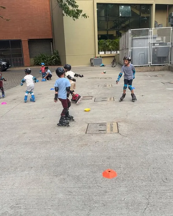 A group of young skaters learns together in their apartment complex. We bring our expert coaching and all the necessary safety gear to you, making it easy and convenient to learn to skate.