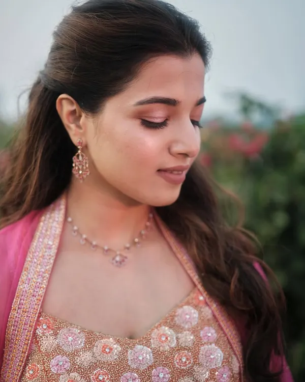 A close-up of Sarah's soft glam makeup. I used hints of pink and soft brown eyeshadow to create a fresh, minimal look that perfectly matched her personality and beautiful pink outfit.