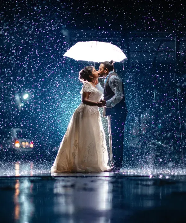 A quiet kiss in a sudden downpour. I believe the most magical wedding photos are the ones you don't plan for. My goal is to find the beauty in every unexpected moment, creating cinematic memories that feel like a scene from a movie.