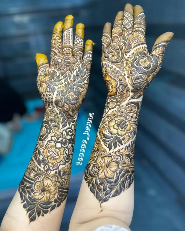 This is what my full bridal mehndi is all about. I cover both hands from the fingertips to the forearms with extremely detailed floral and traditional patterns. Notice the mix of bold shading and delicate lines that make the design pop.