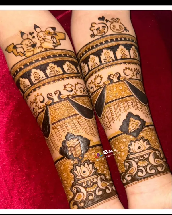 This design was so much fun to create! It features the couple's favorite snacks, popcorn and pizza, along with cute cartoon figures of them on their arms. Your mehendi can truly be about anything you love.