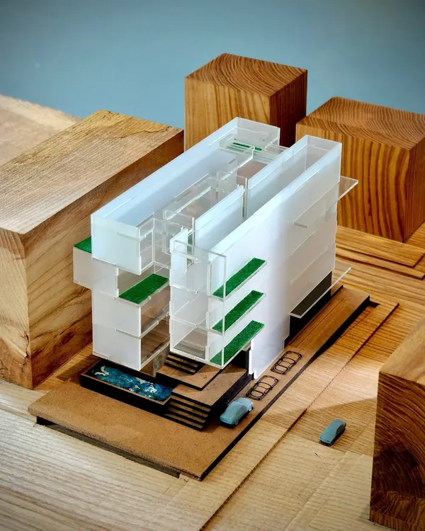 A conceptual model for a residence in New Delhi, using acrylic and wood to study the interplay of solid and void. The green terraces and pool are integrated early in the design process to create a dialogue between the structure and nature.