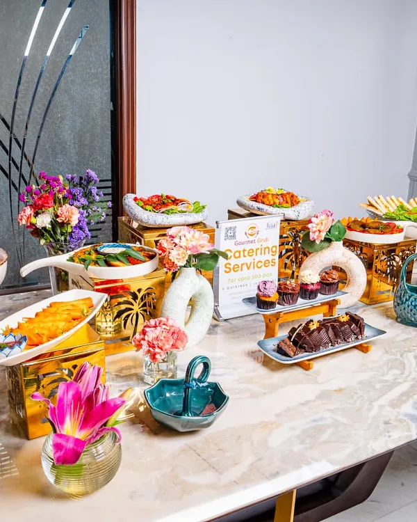 A stunning grazing table setup, showcasing the variety and abundance we offer. It's a full spread of appetizers, snacks, and desserts.