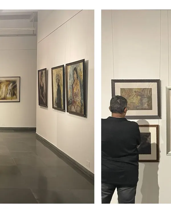 A glimpse into the exhibition 'Vidya Bhushan: Selected Works (1940–1996)'. Visitors are seen contemplating the portraits, showcasing the timeless appeal of Bhushan's art.