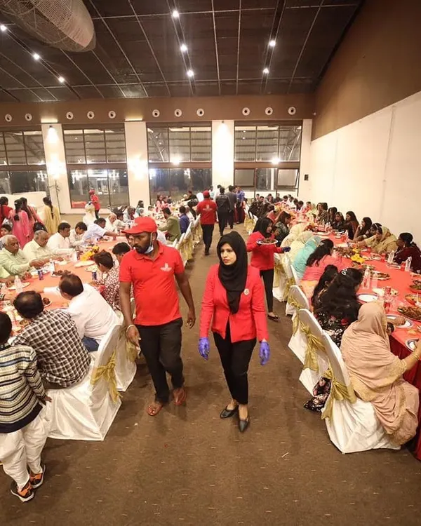 Our trained staff, in uniform, ensuring smooth service and guest management during a large dinner event at Anantia Palace Ground. We focus on professionalism and excellent service for events of any scale.