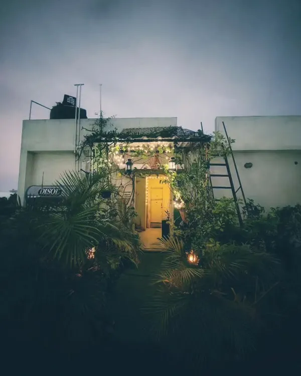 This is my favorite view of the terrace at dusk. The warm glow from the entrance light combined with the string lights makes the entire space feel incredibly inviting and peaceful.