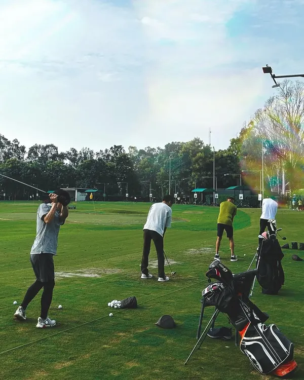 A dynamic shot of our driving range on a sunny day. With plenty of space and multiple golfers in action, it captures the vibrant energy of a weekend at Hamoni.