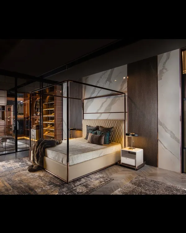 The QUATTRO bedroom collection is a study in material synergy. It combines a four-poster bed, a walk-in wardrobe, and custom wall paneling in statuario tile and veneer to create a fully realized, luxurious bedroom suite.