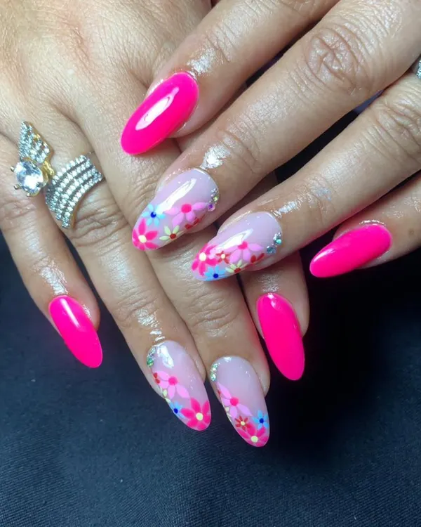A vibrant, glossy hot pink set with accent nails featuring delicate, hand-painted flowers.