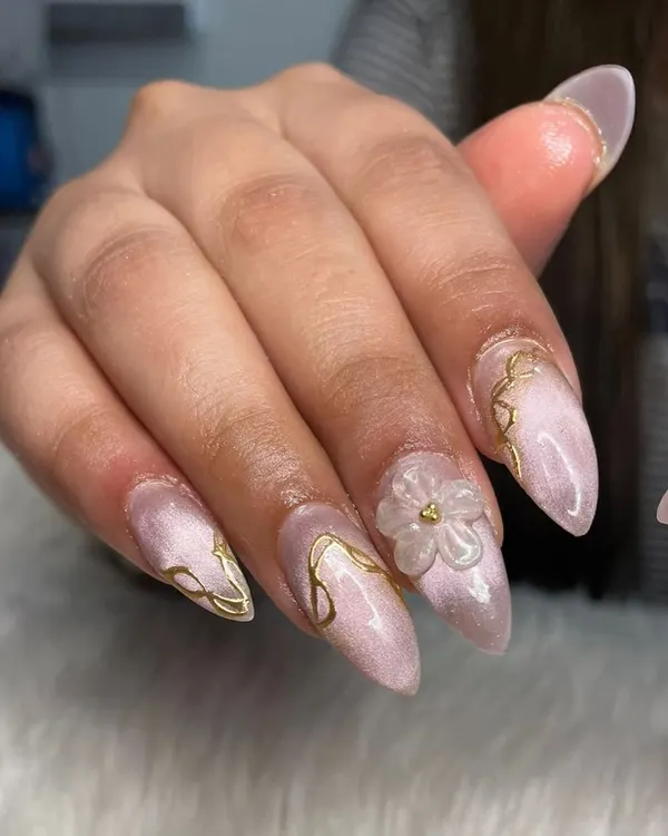 This look combines three of my favorite techniques: a soft pink cat eye base, delicate gold chrome lines, and a hand-sculpted 3D flexi gel flower. It's the ultimate luxury manicure for when you want to feel extra special.
