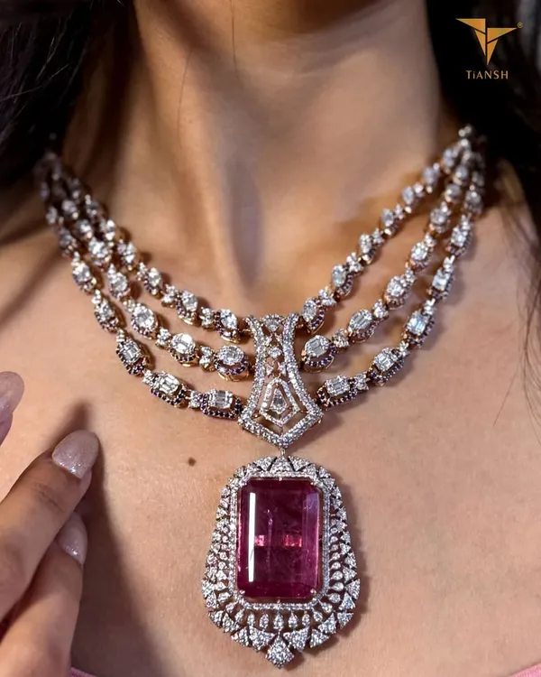 This regal set is where tradition meets timeless splendor. I designed this piece with diamonds encircling a striking pink gemstone, echoing the grace and grandeur of our heritage for the woman who wants her jewellery to tell a story of elegance.