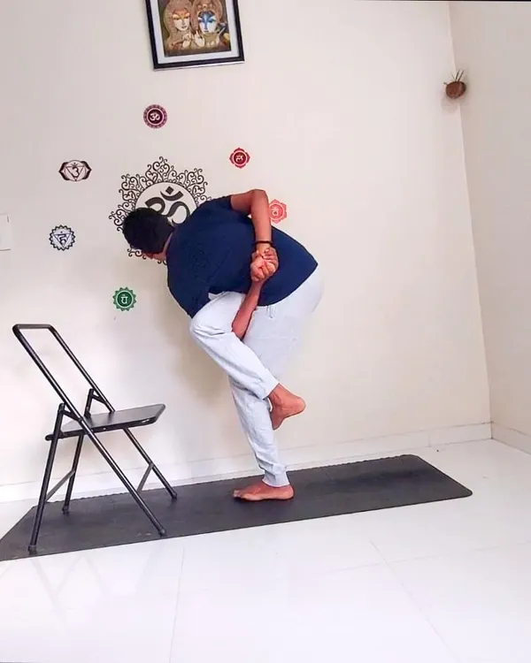 Here I use a chair to assist in Parivrtta Svarga Dvijasana, the Revolved Bird of Paradise Pose. Props are invaluable tools in therapeutic yoga, allowing us to safely access the benefits of advanced poses involving twists, stretches, and balance.
