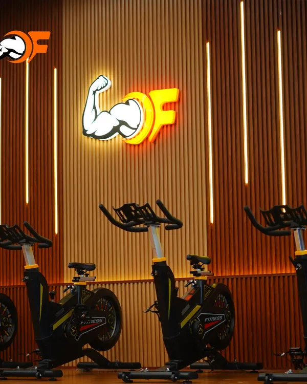 A look at our dedicated spin cycle area within the Group X studio. The modern design, wood-paneled walls, and ambient lighting create an immersive and motivating environment for your cardio workout.
