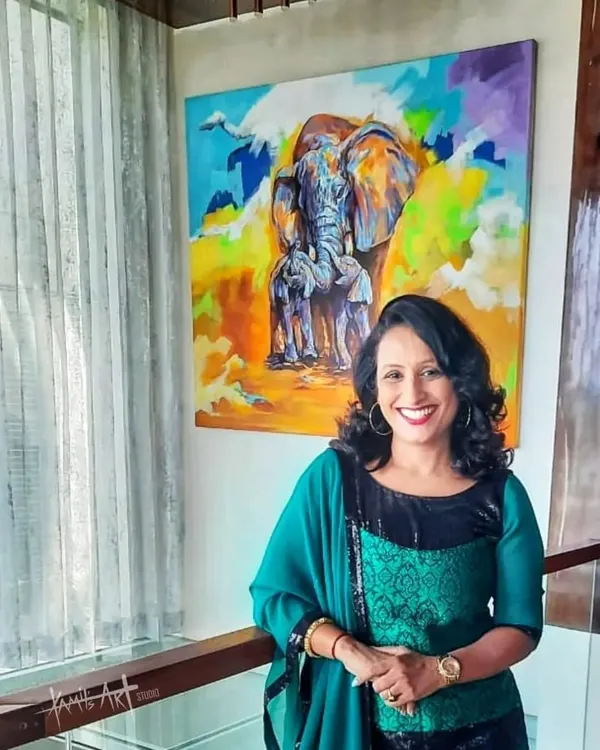 A wonderful client posing with her new 'Mother Love' elephant painting. The large, colorful canvas brings so much life to her beautiful home, and her smile says it all.