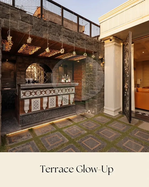 For this project, we designed a custom outdoor bar with an ornate facade and integrated lighting. It’s a permanent, high-impact feature that becomes the centerpiece for entertaining, complemented by stone flooring that has artificial grass growing between the pavers.