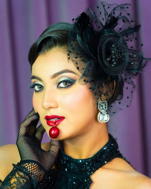 A modern muse look with a bold, artistic flair. This style features soft brown smoked-out eyes, a statement berry lip, and luminous, sculpted skin for a runway-ready finish.
