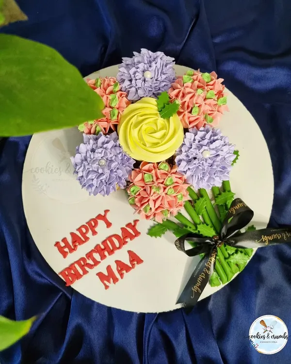 A cupcake bouquet I made for a birthday. I arrange the cupcakes to look like a real bouquet of flowers, with each one piped to look like a different bloom.