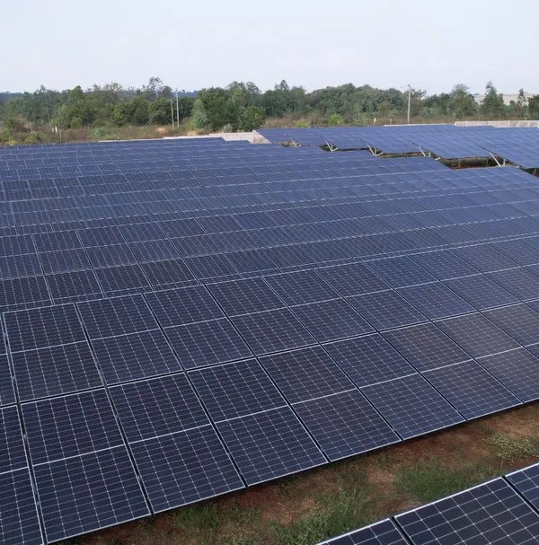 An aerial view of our landmark 1.3 MW solar installation, a project capable of generating approximately 6500 units of clean energy every day. This showcases our capacity to deliver large-scale solar farms that power communities and industries.