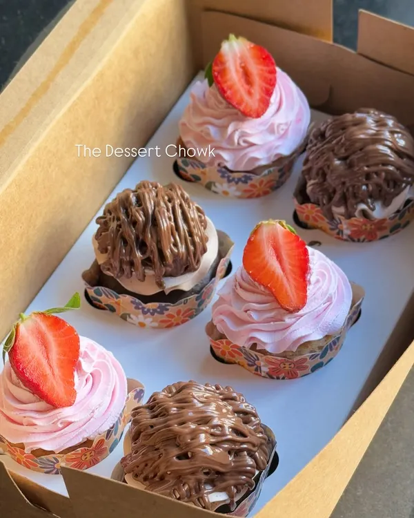 An assorted box of six cupcakes, featuring a mix of my Strawberry Fresh Cream and Nutella Mousse flavors. It's the perfect way to sample two of my most popular cupcake varieties.