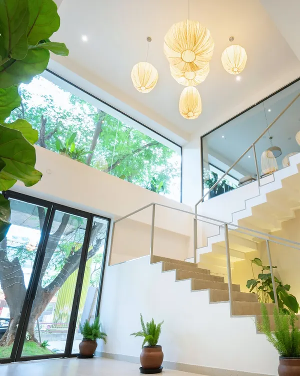 This is the heart of our Indiranagar space. I designed it to be bright, airy, and full of natural light, creating a calm and inspiring atmosphere from the moment you walk in.