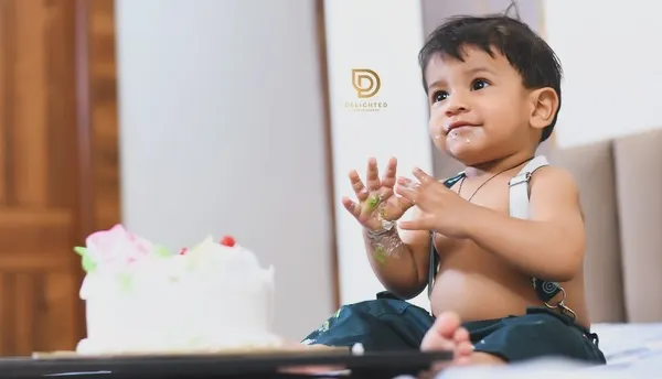 This is what pure joy looks like. I love capturing the wonderfully messy and happy moments of a first birthday cake smash, creating memories your family will laugh about for years.