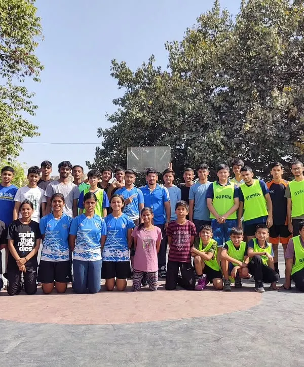 This is our team, our family. This group photo captures the spirit of our academy after a tough practice match. We foster a supportive community where players of all ages come together to push each other and grow.