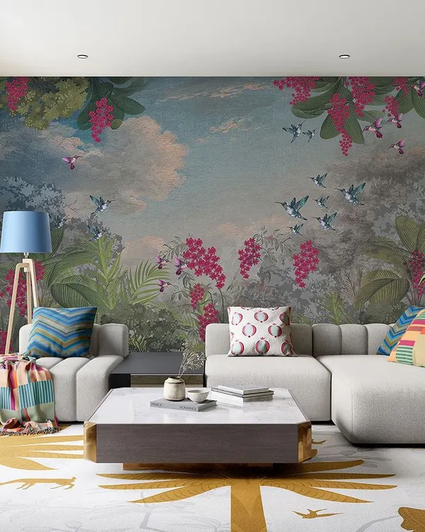 This vibrant, painterly mural of a sky with birds and flowers turns a living room wall into a stunning piece of art. It's a bold choice that brings energy and color into the home.