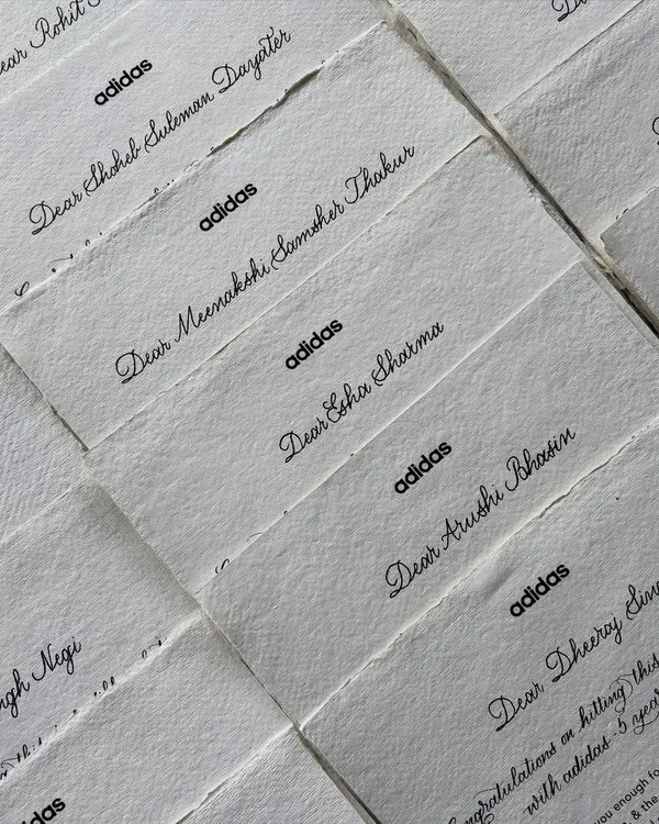 For this project with Adidas India, I addressed over 75 appreciation notes by hand. The combination of a typed message with digital and handwritten calligraphy on textured paper creates a beautiful and heartfelt keepsake.