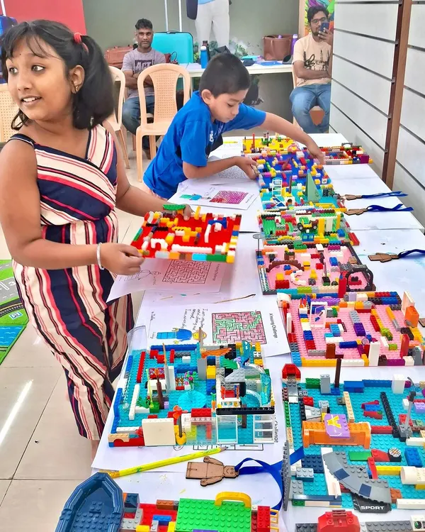 Look at all those amazing finished projects! Kids proudly display their unique LEGO creations after a session of focused building and imagination. Each model tells a different story.