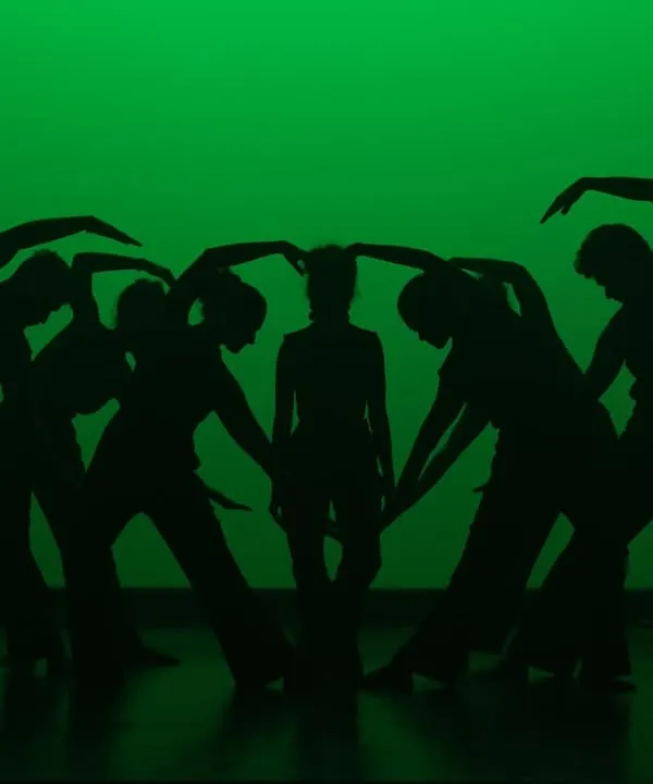 A creative silhouette formation by our contemporary dancers. We encourage artistic expression and teamwork to create visually stunning moments like this on stage.