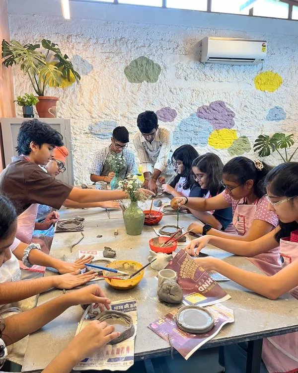 A table full of busy hands and budding artists. Our hand-building workshops are perfect for groups, allowing kids to socialize while they roll, shape, and create with clay.