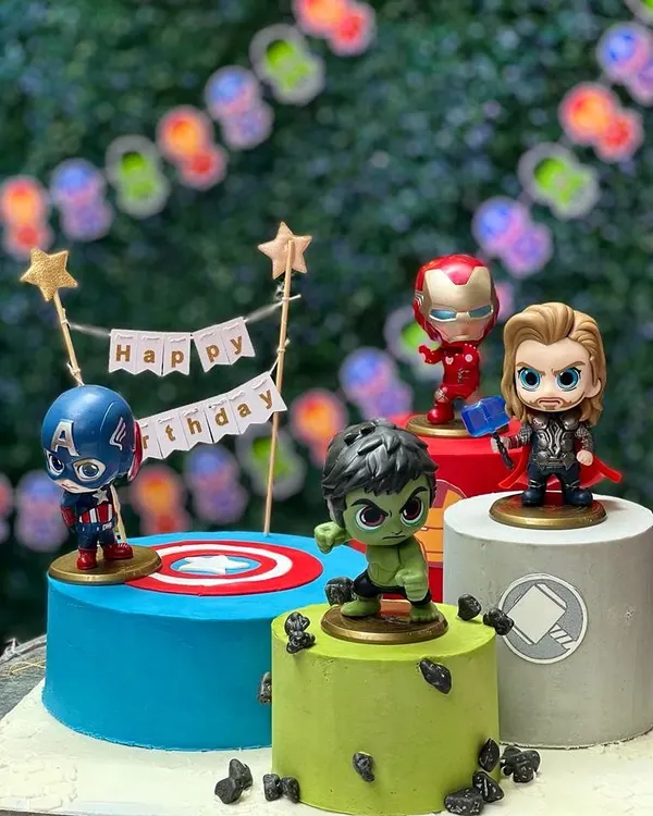 Avengers assemble for a super birthday! This multi-cake setup features individual cakes for Hulk, Captain America, Iron Man, and Thor, creating an epic display for a young superhero fan.